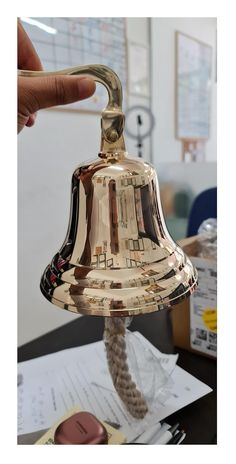 PRICES MAY VARY. This Handcrafted bell is made up of high quality solid brass for Clear distinct ringing tone. The bell stands 6 inches in diameter with thick rope cord. Heavy-duty Marine wall mounted design is perfect for engraving for a gift and great way to get student's attention. The pleasant chime sound is loud as well as clearly without noisy sound, which can be heard at a distance and truly a stunning piece of nautical décor. This vintage bell is ideal for Hotel, School, Dinner and Recep Door Bell Inside, Brass Bell Chimes, Antique Bell Walmart, Shop Keepers Door Bell, Brass Bell Wall Art, Devol Aged Brass Hanging Rail, Brass Outside, Dinner Bell Post, Brass Types