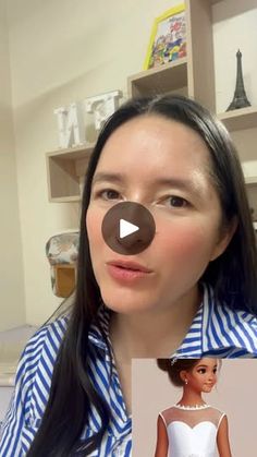 a woman with long black hair wearing a blue and white striped shirt looking at the camera