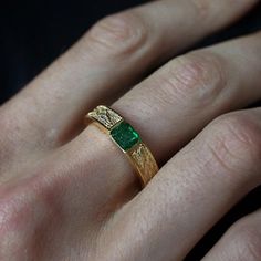 This stylish textured Emerald Dragon Ring was inspired by dragon scales. Handcrafted in 14K gold. This ring features a natural one-of-a-kind deep green emerald. Materials: 14K gold Natural 4.8x5.4mm natural emerald. Approx. 0.7ct Solid band 5mm bandwidth ** Tippy Taste Men's are made-to-order. Please allow 2-3 week turnaround time. This ring is not resizable, please ensure your ring size before ordering. Shipping:Domestic: Free standard shipping within the U.S.International: Free standard shippi Man Emerald Ring, Men's Emerald Ring, Mens Emerald Rings Wedding Bands, Mens Gemstone Ring, Green Wedding Ring Men, Emerald Engagement Ring Men, Emerald Wedding Rings Men, Green Wedding Rings For Men, Men Emerald Ring