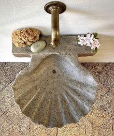 a bathroom sink sitting on top of a wooden floor