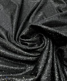 black fabric with silver glitters on it