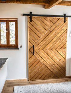 an open wooden door in a white room