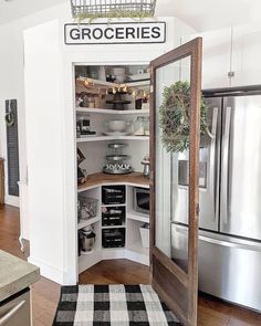 an open pantry in the corner of a kitchen