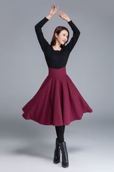 "A circle skirt is a full, flowy skirt that gets its name from the circular shape of the skirt when it is spread out. High waist flared midi skirt for autumn winter. DETAIL * 30% wool, 30% fiber, 40% polyester * fully satiny liner * Hidden zipper in the back * Two pockets on each side * high waist skirt * knee length skirt * Perfect for autumn, winter * Dry clean CUSTOM MADE SERVICE If you * Need a tailored clothes with your body measurement * Need a Better fit * Can't find your size in the size Red Long Skirt For Fall, Winter Full Skirt, Red Winter Skirt With Relaxed Fit, Red Full Skirt For Fall, Winter Full Skirt With Lining, Elegant Full Mini Skirt For Winter, Elegant Winter Full Mini Skirt, Winter Flared Gathered Skirt, Winter Full Skirt With Gathered Detail