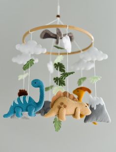 a mobile with stuffed animals hanging from it's sides