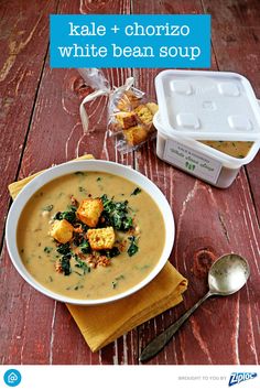 a bowl of soup with tofu, kale and chorizzo white bean soup