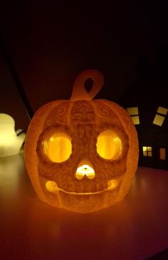 a carved pumpkin sitting on top of a table