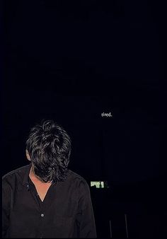 the back of a person's head in front of a black background with words on it