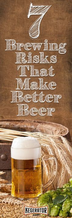 a glass of beer sitting on top of a table next to a barrel and hops