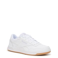 These women's Reebok Court Advance white/cold grey/gum fashion athletic shoes can take your sporty looks a notch up. Featuring leather upper, these athleisure sneakers have optimal lace-up closure, perforations on toe box for ventilation, plush textile lining, cozy OrthoLite sockliner, DMX Microbubbles in midsole for enhanced comfort, and long-lasting rubber outsole. This style is exclusive to Designer Brands Canada. | Reebok Women's Court Advance Sneaker in White/Cold Grey/Gum Leather Size 8. 5 Women Reebok Sneakers, Reebok Women Outfits, Fashion Athletic Shoes, Reebok White Sneakers, Reebok Shoes Women, Dressy Sneakers, Money Clothes, Wide Sneakers, Aged Cheese