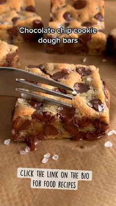 a chocolate chip cookie dough bar is being cut into squares with a knife and fork