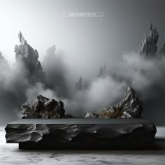 an artistic photo with rocks and fog in the air, on a black and white background