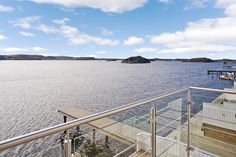 there is a balcony overlooking the water and boats