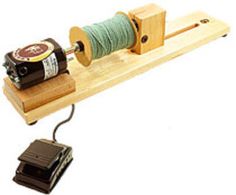 an electric device is hooked up to a cord on a wooden board with a small charger