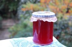 a jar filled with liquid sitting on top of a table