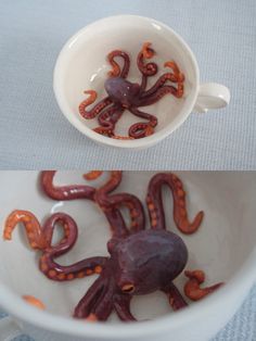 an octopus is in a bowl with water and orange squid tentacles are inside the bowl