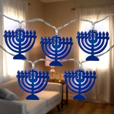 the menorah is lit up in blue and has five candles arranged on it