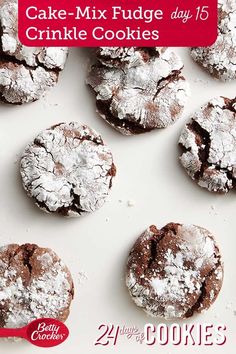 cookies are covered in powdered sugar on a white surface with the words cake mix fudge day 15 crinkle cookies