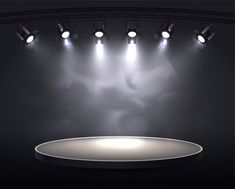 an empty stage with spotlights and spot lights on the ceiling, in front of a black background