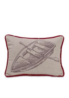 a pillow with a boat and paddles drawn on the front, sitting on a white background