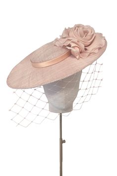 Classically elegant disc hat with flower and veil.‘Aurelia’ is a perfectly proportioned and flattering silhouette to see you through the summer season.From Weddings to the Royal Enclosure at Royal Ascot, a timeless style that is light and comfortable to wear.The soft wire headband discretely keeps the hat in place and is effortless to put on, with no risk of ‘hat hair’. --- Pinokpok base with silk flower and trim. Dye-to-Match Colour service offered for the style. Luxury Elegant Hats For Fall, Luxury Wedding Hats For Spring, Luxury Women's Hats For Royal Ascot, Luxury Hats For Royal Ascot And Vintage Events, Luxury Hat With Structured Crown For Royal Ascot, Luxury Elegant Boater Hat For Royal Ascot, Luxury Elegant Boater Hat For Wedding, Elegant Luxury Mini Hats For Ceremonies, Luxury Elegant Party Hat