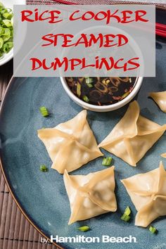 some dumplings are sitting on a blue plate