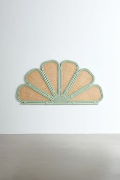 an art deco fan is mounted on the wall