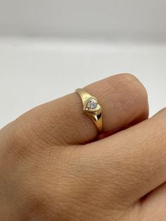 This cute 14K gold heart signet ring with a center stone is the perfect size for a baby, child, or pinky ring for women. The center stone is a simulated pink or white diamond (Cubic Zirconia). The ring is made of 100% 14K gold. It's a beautiful ring for a little girl or a gorgeous pinky ring.  Ring pictured on woman's 2 1/2 pinky finger    * 14K Solid Gold * High Quality Cubic Zirconia Stone * Small sized Ring ▬ All jewelry pieces are sent in a gift box  ▬ Our shipping and return policies: ~ Ite Dainty Pinky Ring, Women’s Pinky Rings, Heart Pinky Ring, Womens Pinky Ring, Small Gold Rings, Gold Pinky Ring Women, Little Finger Rings For Women, Pinky Ring Stack, Pinkie Rings For Women