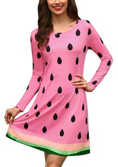 a woman wearing a pink dress with black polka dots