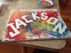 this is an image of the name jackson painted on a canvas with paintbrushes