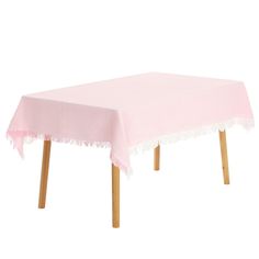 a pink table cloth with wooden legs