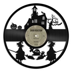 a vinyl record with the words chain reaction on it and witches in front of a house