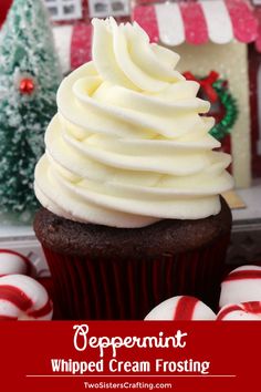 a chocolate cupcake with white frosting and candy canes in the background text reads peppermint whipped cream frosting