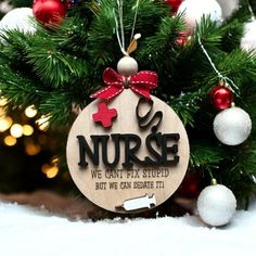 🎄✨ **Nurse Christmas Ornament - Funny Engraved Design** 🎄✨ Looking for the perfect gift for the amazing nurse in your life? 🎁 This delightful Christmas ornament will bring joy and laughter to their holiday season! Featuring a hilarious saying, it's a charming addition to any tree!  **Choose from two funny sayings 1. **"We Can't Fix Stupid, But We Can Sedate It!"** 😂💉 2. **"Every Nurse Has A Friend Named Pam"** 😂❤️ Each ornament is crafted with love and care, making it a unique gift that's sure to spark smiles and warm hearts. Hang it on the tree or display it proudly in the office!  **Product Details - Material: High-quality wood - Size: 3 inches round  - Comes with a beautiful ribbon for easy hanging 🎀 Spread some holiday cheer and show appreciation for our dedicated nurses with th Nurse Christmas Ornament, Nursing Ornaments, Nurse Ornament, Nurse Ornaments, Nurse Christmas, Gift For Nurse, Engraved Design, Show Appreciation, Nurse Practitioner