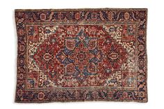 an antique persian rug with red and blue colors