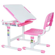 a pink and white children's desk and chair set up with a laptop on it