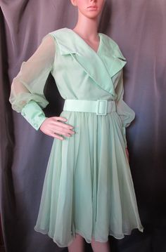 "Dreamy vintage circa 1970's special event dress.  In floaty mint green chiffon over satin, it has a wide collar with asymmetrical, snap close at the bodice.  A self fabric, pull through belt cinches the waist as it leads to a full skirt. The 22\" sleeves are sheer chiffon with 4\" wide satin cuffs that close with buttons. The back closes with a 20\" nylon zipper. The label reads Coco California. Size tag says 10 and 100% polyester.  The belt is marked Belair Belt Company, size 10 Size: Tag says Special Event Dresses Parties, Dress Mint Green, Special Event Dresses, Dress Mint, Event Dress, Sheer Chiffon, Dress Party, Sheer Sleeves, Vintage Dress