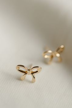 Rumor has is that 2024 is the year of BOWS! These super cute, bow stud earrings are the dainty, delicate, and prefect for all day wear. Includes two gold or silver-plated bow studs Approx. 1/2" Choose from either gold or silver Cute Earrings Aesthetic Gold, Bow Tie Earrings, Western Earrings Fashion, Western Jewellery, Everyday Wear Jewelry, Cute Stud Earrings, Earrings Ideas, Bow Jewelry, Earring Studs