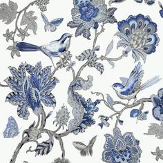 a blue and white wallpaper with birds, flowers and butterflies on it's side