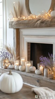 a mantle with candles and flowers on it