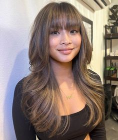 Polished Long Layered Hairstyle for Chubby Faces Bangs With Medium Hair Balayage, Long Hair With Wispy Layers, Wispy Full Bangs, Wispy Bangs Wide Face, Wispy Choppy Bangs, Chubby Cheeks Haircut, Brown Wispy Bangs, Bangs For Oval Face Shape, Bangs Chubby Face