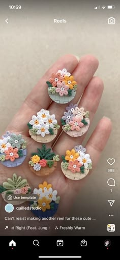 a person is holding some miniature flowers in their hand on the app store's iphone