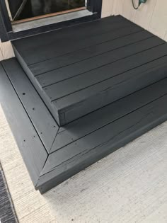 the steps are made out of wood and have been painted black