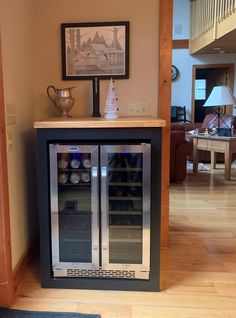 a wine cooler in the corner of a living room