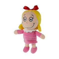 a small stuffed doll with a red bow on her head and pink dress, standing upright