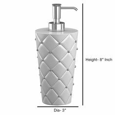 the height of a white ceramic soap dispenser with diamond design on it