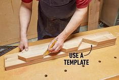 a man is working on a piece of wood with a pencil in his right hand