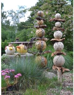 a garden with lots of different types of plants and decorations on the top of it