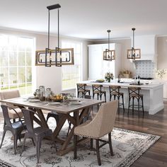 a dining room table and chairs in front of an open kitchen with lots of windows