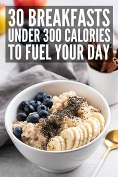 a bowl filled with oatmeal, bananas and blueberries on top of a table